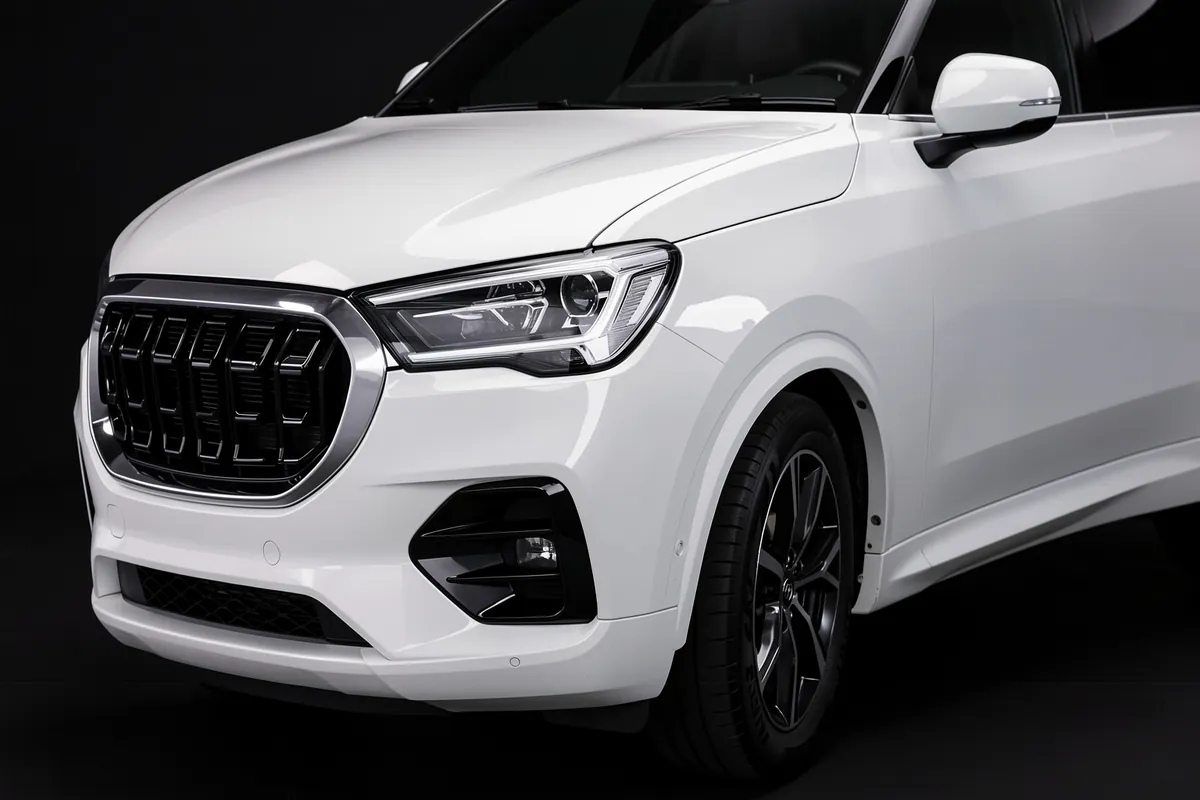 White SUV with body-colored mirror caps and lower trim