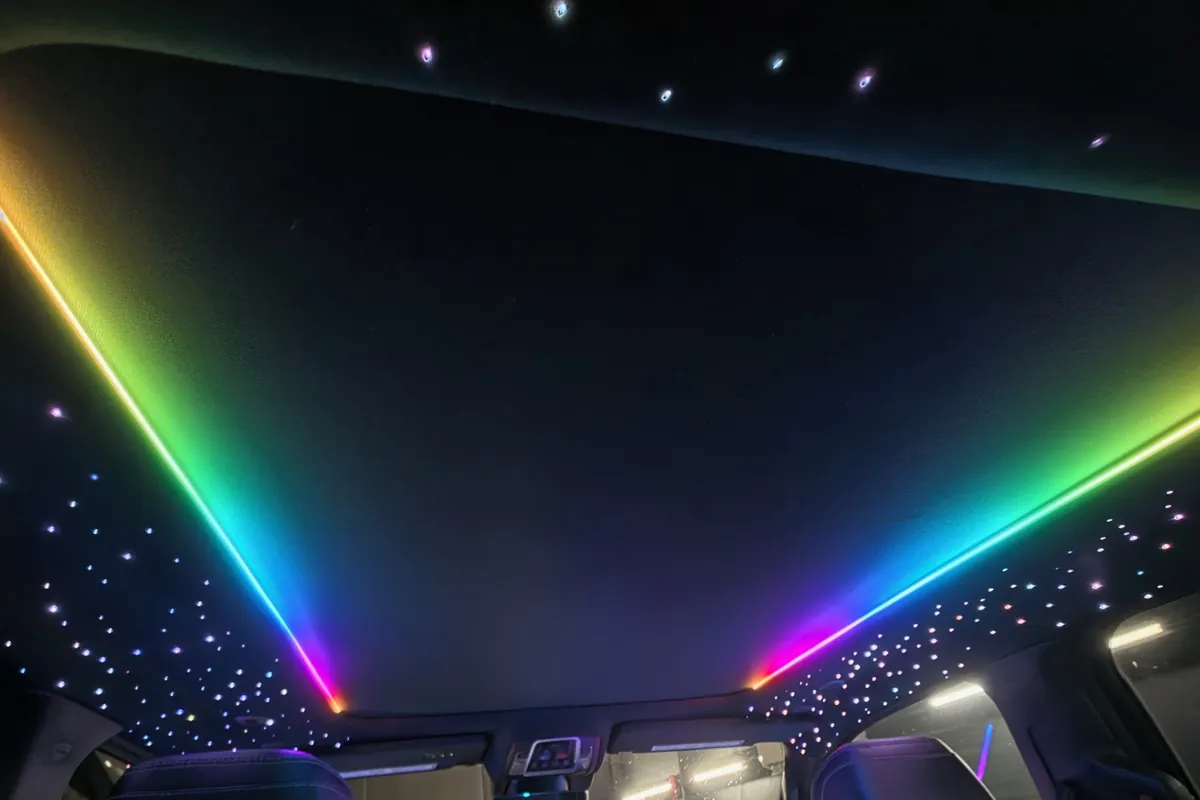 Rainbow light lines and fiber-optic stars across a Ram pickup headliner