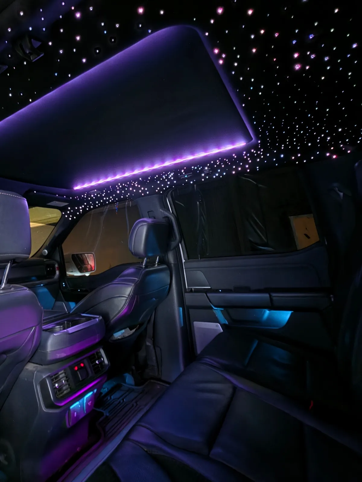 Purple Dream Color sunroof strip framed by fiber-optic stars in a Ford F-150